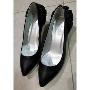 CCL black heels with ruffled back